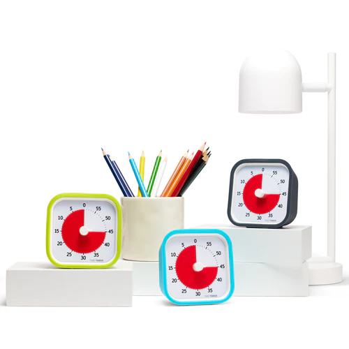 Laimiroheline, türkiissinine ja süsihall Time Timer MOD laual.